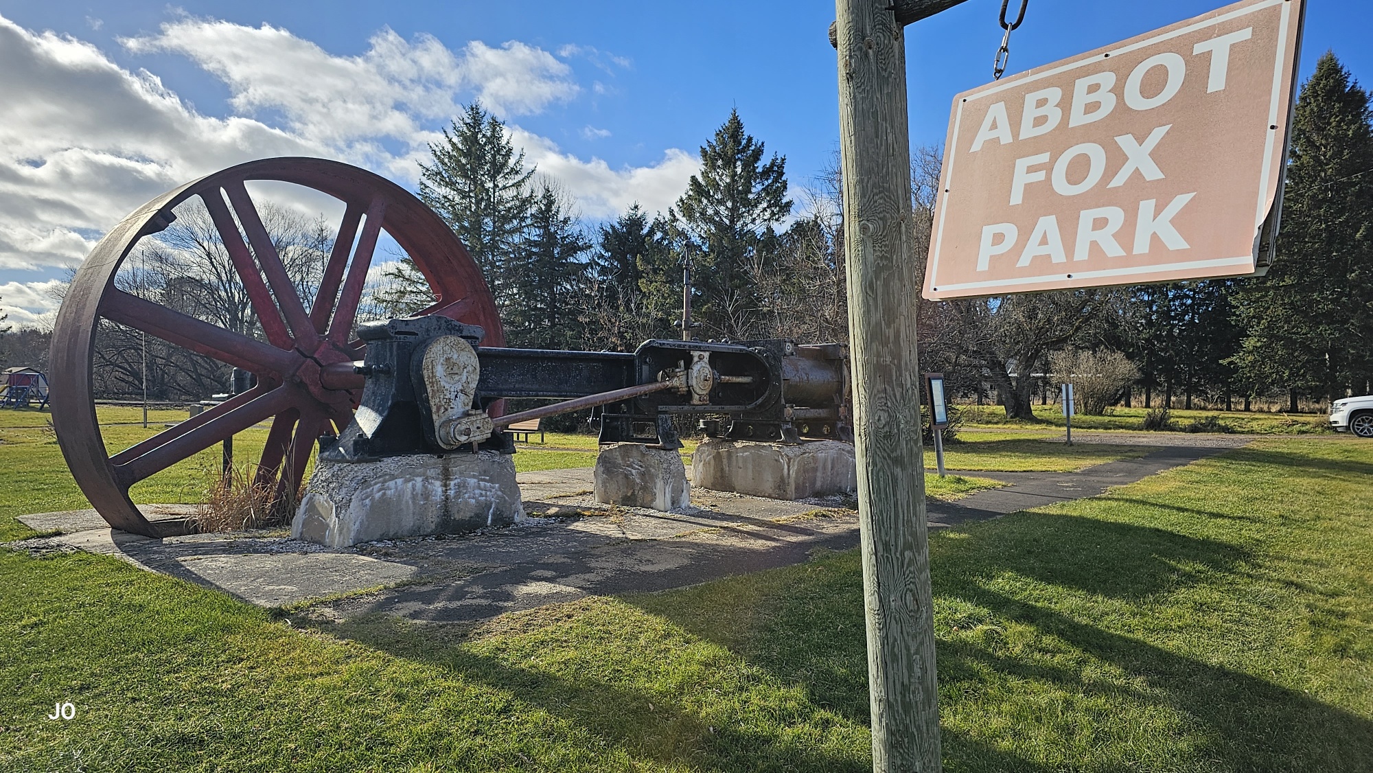 Abbot Fox Park entrance with mining wheel display.