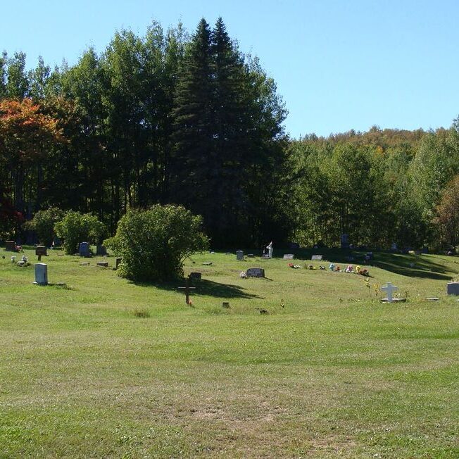 Peaceful cemetery in sunny autumn landscape